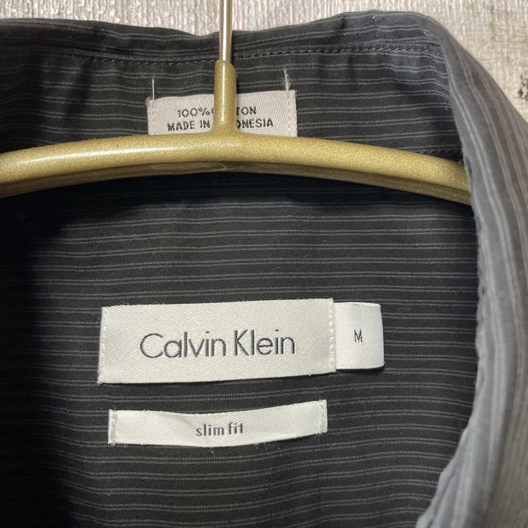 Calvin Klein(カルバンクライン)のカルバンクライン　黒ブラックストライプ　縦縞　薄手　ＣＫ　奇麗目シルエット　古着 メンズのトップス(シャツ)の商品写真