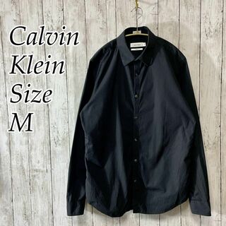 カルバンクライン(Calvin Klein)のカルバンクライン　黒ブラックストライプ　縦縞　薄手　ＣＫ　奇麗目シルエット　古着(シャツ)
