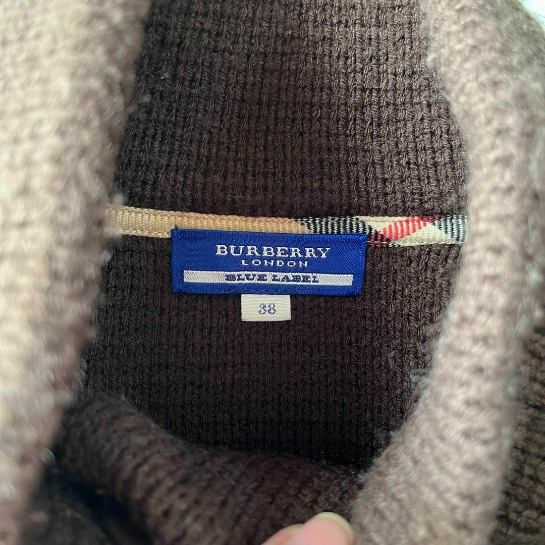 BURBERRY BLUE LABEL(バーバリーブルーレーベル)のバーバリーBURBERRYニットポンチョブラウンロゴ入り古着 レディースのジャケット/アウター(ポンチョ)の商品写真