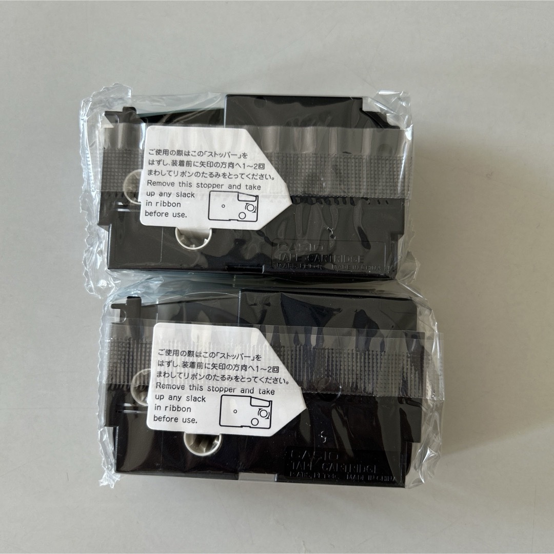 CASIO(カシオ)のカシオネームランドテープカートリッジ透明黒文字12ミリ18ミリ2個セット インテリア/住まい/日用品のオフィス用品(オフィス用品一般)の商品写真