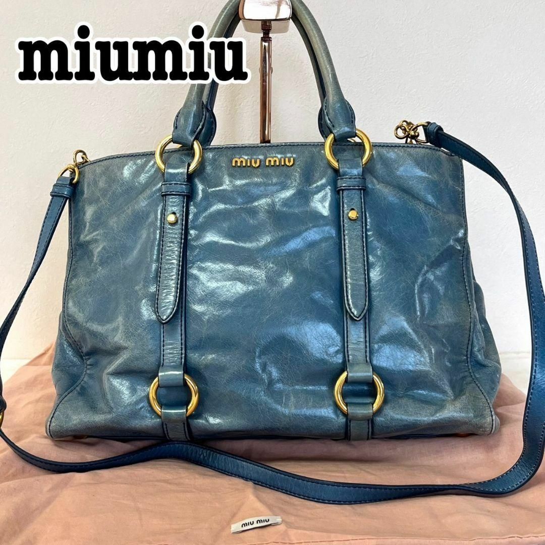 定価から3０％オフ Miu miumiu ゴールド ミュウミュウ 2way ハンド・ショルダーバッグ 通販セレクトショップ ショルダーバッグ レザー  Miu(ミュウミュウ)2WAYレザーショルダーバッグ　FRAGOLA トートバッグ　ショルダー　ブルー　ゴールド　ロゴ バッグ