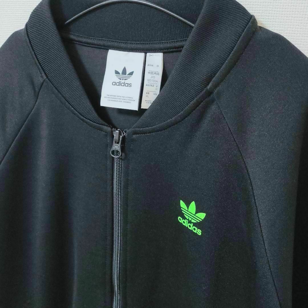 Originals（adidas）(オリジナルス)のアディダス 黒×緑 スワロフスキー SST ジャージ トラックトップ メンズO メンズのトップス(ジャージ)の商品写真