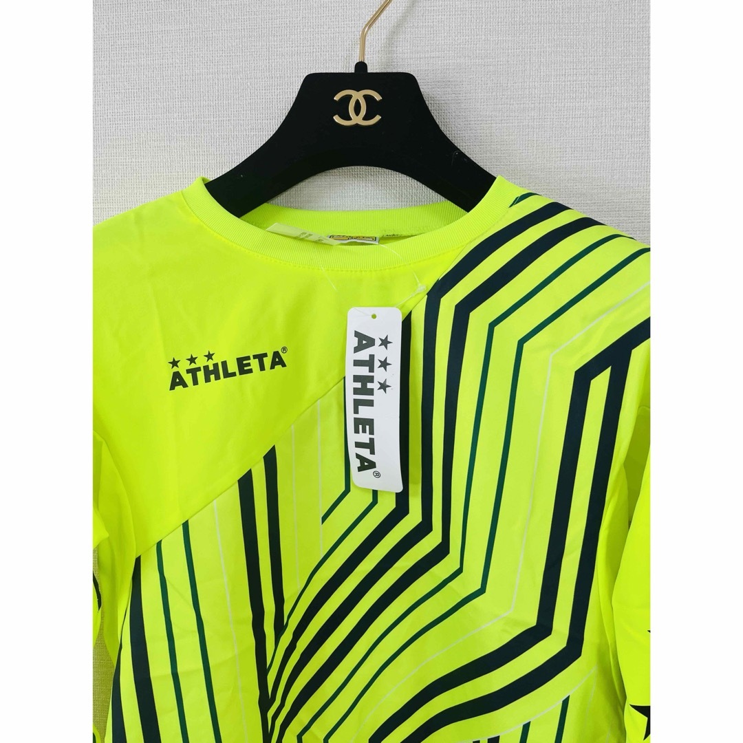 ATHLETA(アスレタ)のアスレタ　ウインドピステシャツ&ストレッチパンツ 上下セット　140 黄×黒 スポーツ/アウトドアのサッカー/フットサル(ウェア)の商品写真