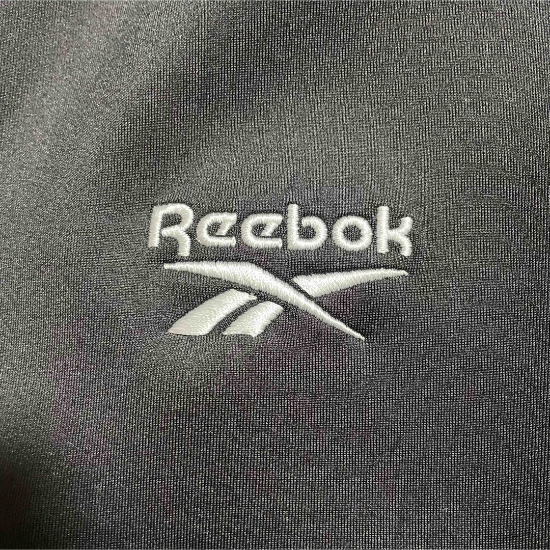 Reebok(リーボック)の【未使用・タグ付き】Reebok ジャージ　セットアップ　上下　ロゴ刺繍　黒　M メンズのトップス(ジャージ)の商品写真