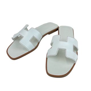 エルメス(Hermes)の新品未使用 Hermes エルメス  Oran オラン White ホワイト Calf カーフ 37（24cm） フラット サンダル レディース(サンダル)