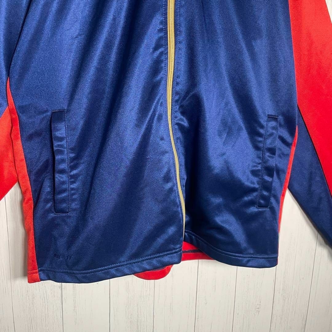 NIKE(ナイキ)の[古着]NIKE　トラックジャケット　金刺繍　バックロゴ　フード付き　青　赤 メンズのトップス(ジャージ)の商品写真