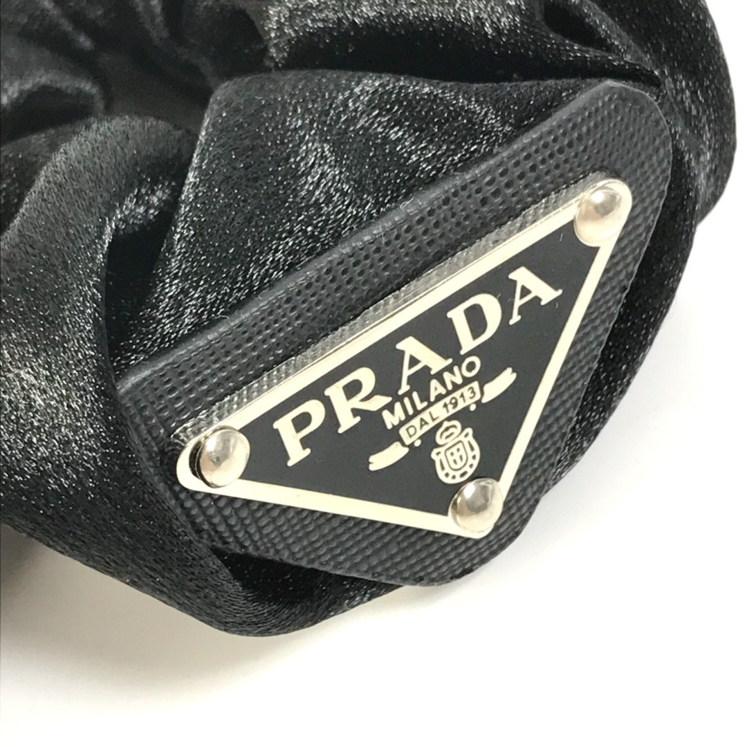 PRADA(プラダ)のプラダ PRADA 三角ロゴ プレート トライアングルロゴ ヘアゴム ヘアアクセサリー シュシュ ナイロン ブラック 新品同様 レディースのヘアアクセサリー(ヘアゴム/シュシュ)の商品写真