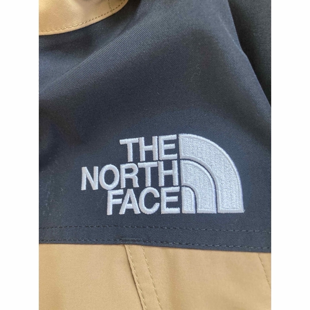 THE NORTH FACE(ザノースフェイス)の値下げ　ノースフェイス　マウンテンダウンジャケット　M　ユーティリティブラウン メンズのジャケット/アウター(ダウンジャケット)の商品写真