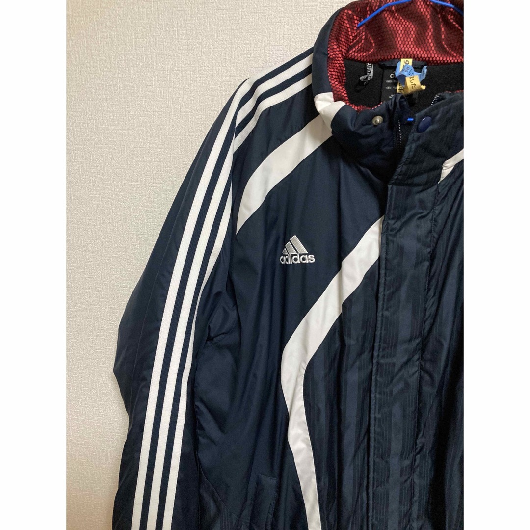 adidas(アディダス)のアディダスベンチコート　XOサイズ　丈を少し短く補正しています　中古です スポーツ/アウトドアのサッカー/フットサル(ウェア)の商品写真