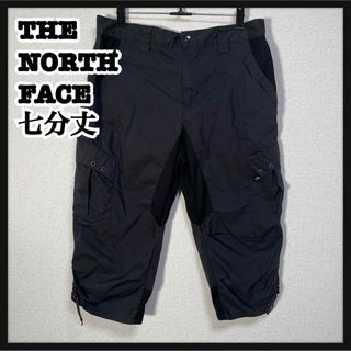 ザノースフェイス(THE NORTH FACE)の【ノースフェイス】ハーフパンツ　七分丈ズボン　黒グレー　ワンポイント　カーゴK1(ショートパンツ)