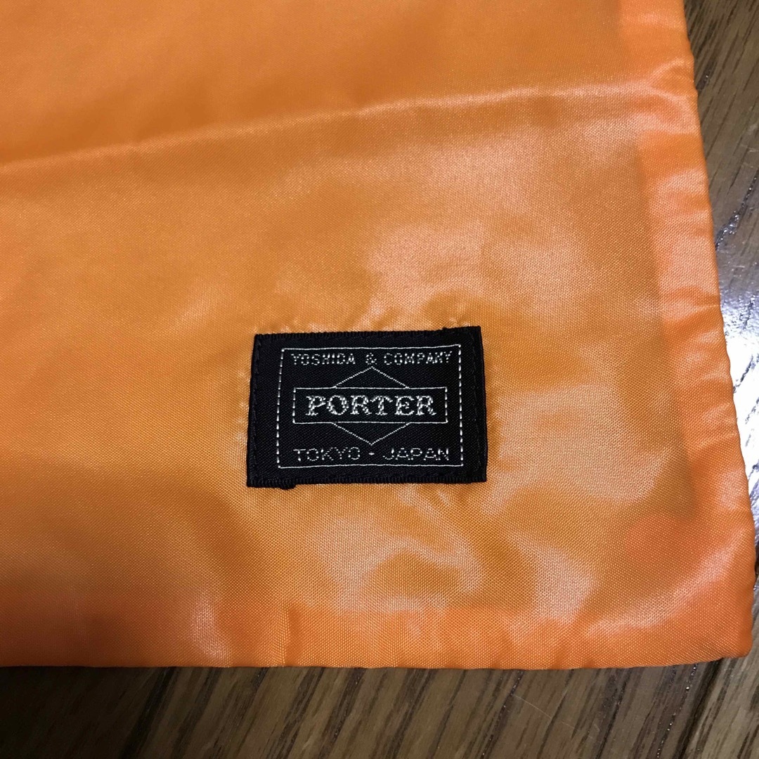 PORTER(ポーター)の未使用　PORTER 保存袋　オレンジ　巾着型 メンズのバッグ(その他)の商品写真