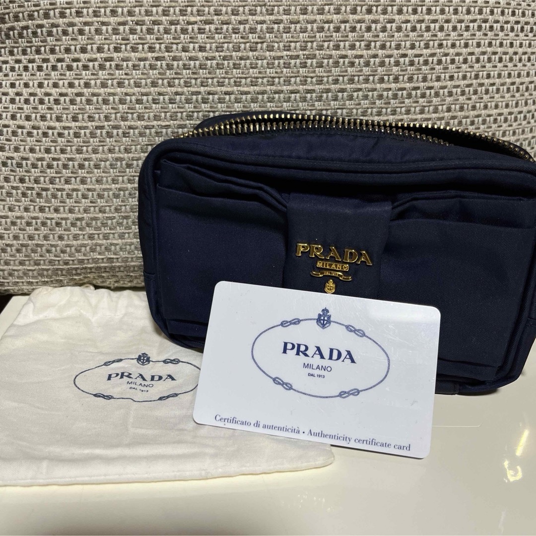 PRADA(プラダ)の値下げ!! PRADA リボンモチーフ ポーチ ネイビー レディースのファッション小物(ポーチ)の商品写真