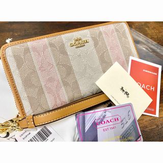 コーチ(COACH)の【新品】COACH ピンク&ベージュ シグネチャ柄 ラウンドzip レザー財布(財布)