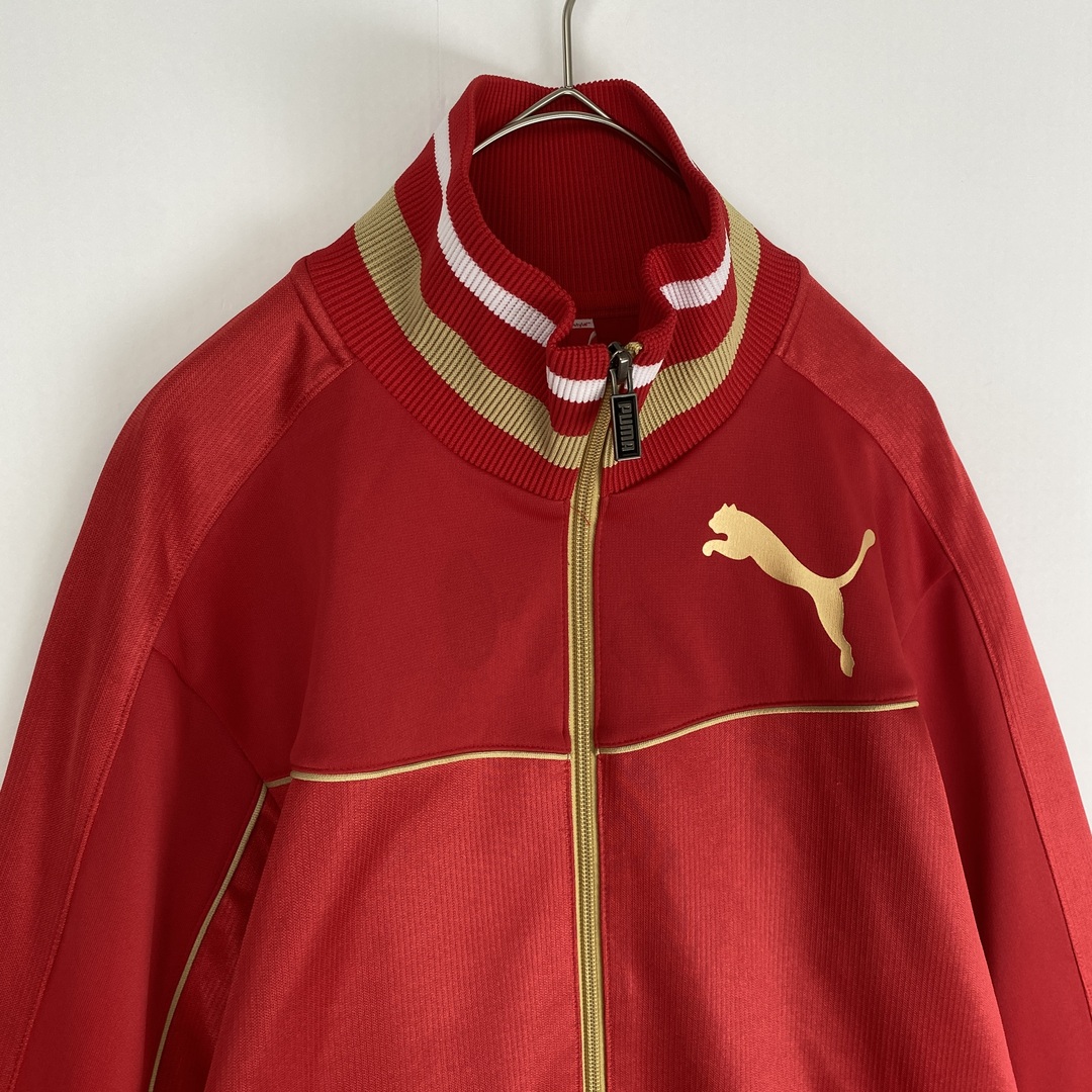 PUMA(プーマ)の【プーマ　トラックジャケット　パイピング　ワンポイント刺しゅう　赤　古着】 メンズのジャケット/アウター(その他)の商品写真