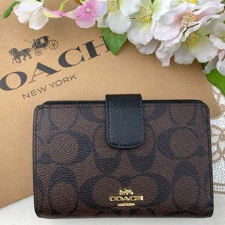 コーチ(COACH)のCOACH シグネチャー × ブラウン ブラック 二つ折り(財布)