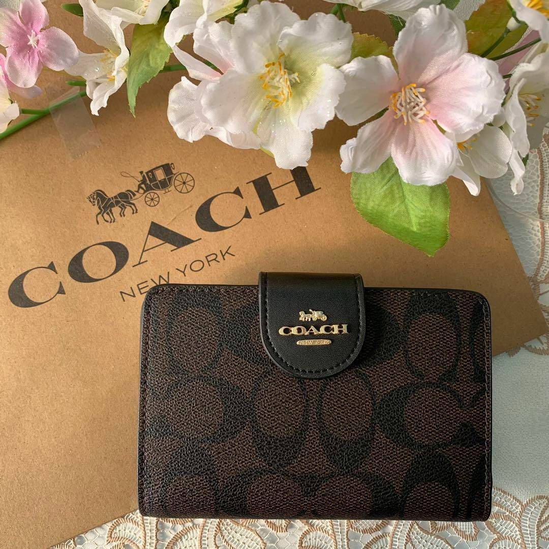 COACH 二つ折りブラック ダークブラウン ベルトロゴレディース