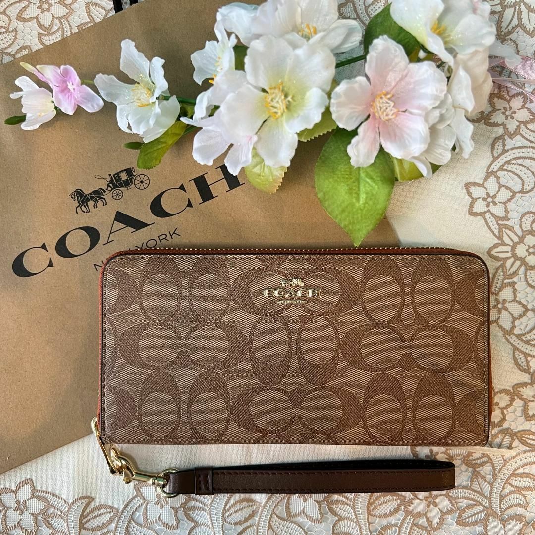 コーチCOACH シグネチャー ベージュ オレンジファスナー ストラップ