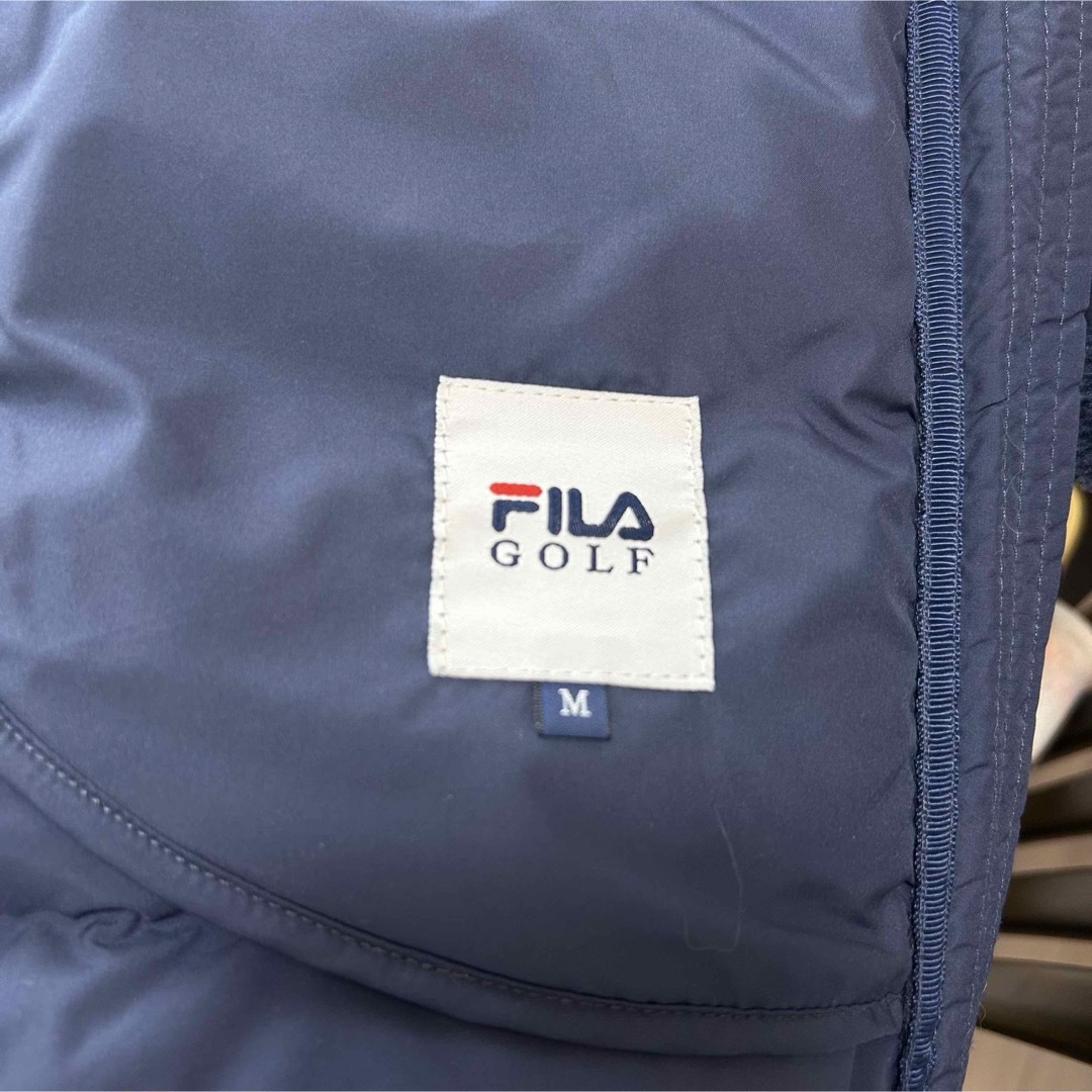 FILA(フィラ)の早い者勝ち！未使用！FILA GOLF ダウンロングコート　ネイビー　M レディースのジャケット/アウター(ダウンコート)の商品写真