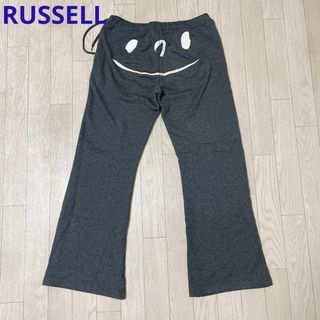 ラッセルアスレティック(Russell Athletic)のRUSSELL ヒップ笑顔プリント グレー スウェットパンツ(カジュアルパンツ)