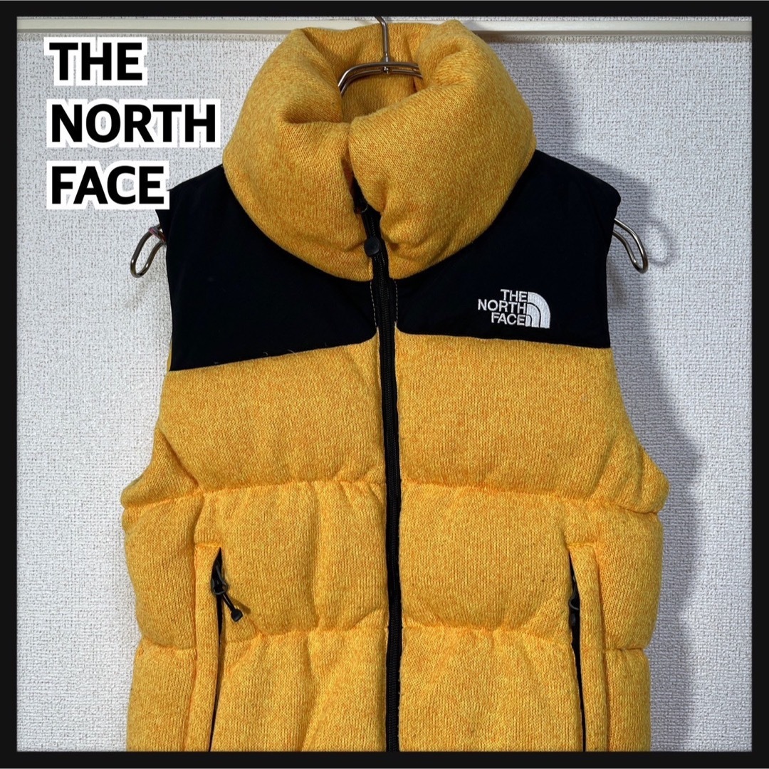 THE NORTH FACE(ザノースフェイス)の【ノースフェイス】ブルームダウンベスト グース刺繍　黒黄色ワンポイントヌプシK2 レディースのジャケット/アウター(ダウンベスト)の商品写真