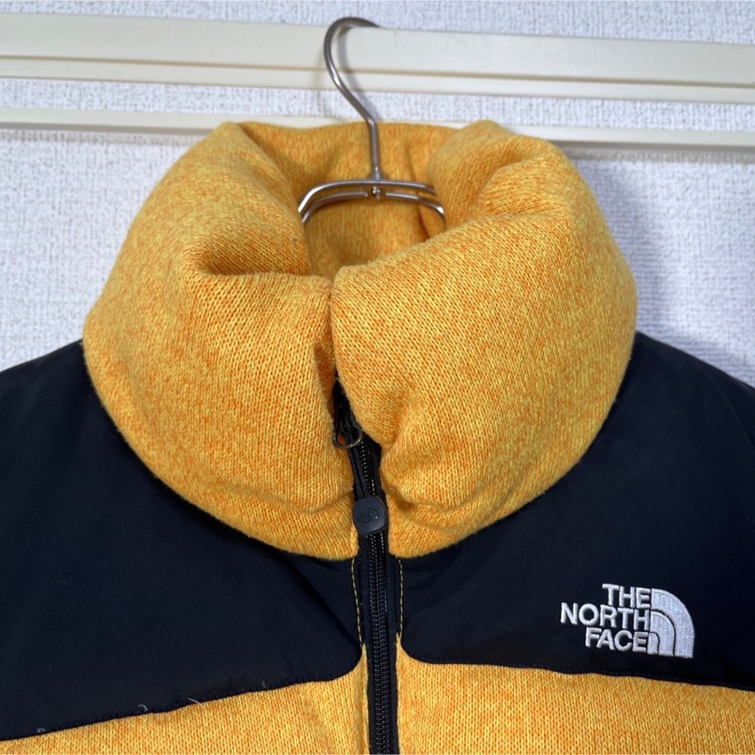 THE NORTH FACE(ザノースフェイス)の【ノースフェイス】ブルームダウンベスト グース刺繍　黒黄色ワンポイントヌプシK2 レディースのジャケット/アウター(ダウンベスト)の商品写真