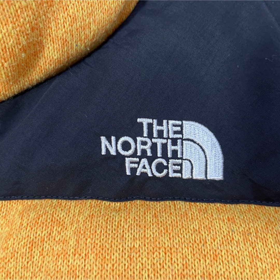 THE NORTH FACE(ザノースフェイス)の【ノースフェイス】ブルームダウンベスト グース刺繍　黒黄色ワンポイントヌプシK2 レディースのジャケット/アウター(ダウンベスト)の商品写真