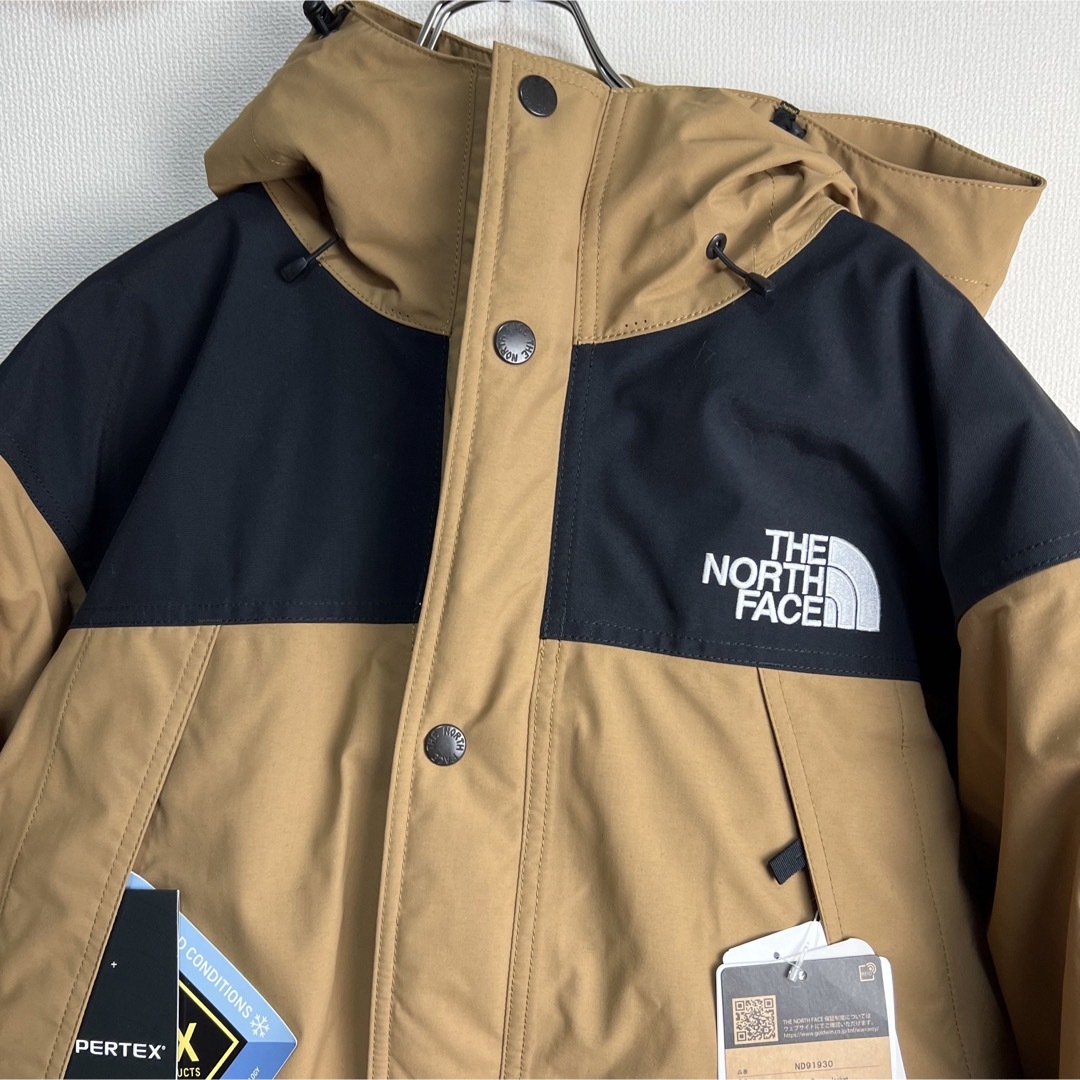 THE NORTH FACE(ザノースフェイス)の新品　ノースフェイス　マウンテンダウンジャケット　ND91930 ブラウン　XL メンズのジャケット/アウター(ダウンジャケット)の商品写真