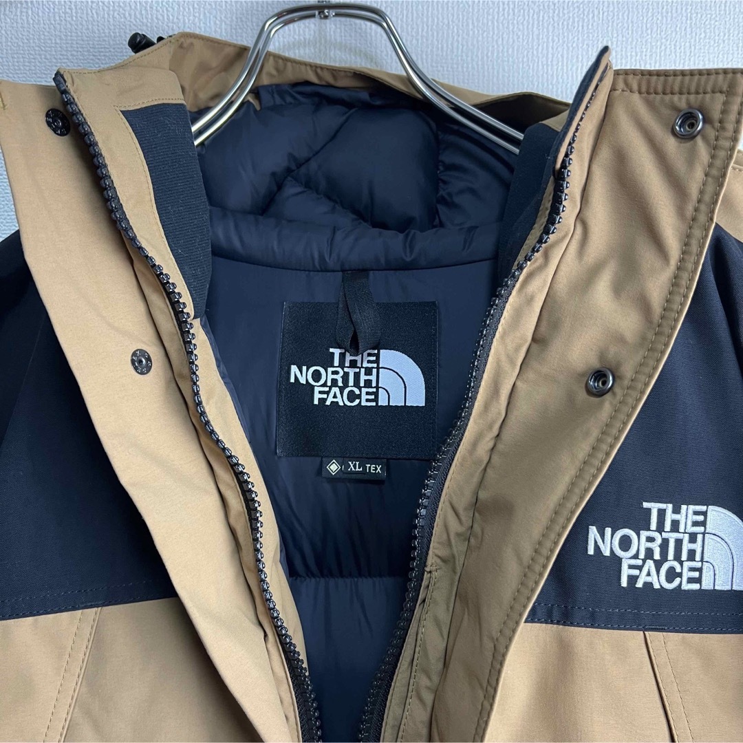 THE NORTH FACE(ザノースフェイス)の新品　ノースフェイス　マウンテンダウンジャケット　ND91930 ブラウン　XL メンズのジャケット/アウター(ダウンジャケット)の商品写真