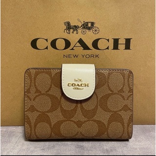 コーチ(COACH)の新品　COACH  二つ折り財布　ホワイト ブラウン シグネチャー　小銭入れ有(財布)