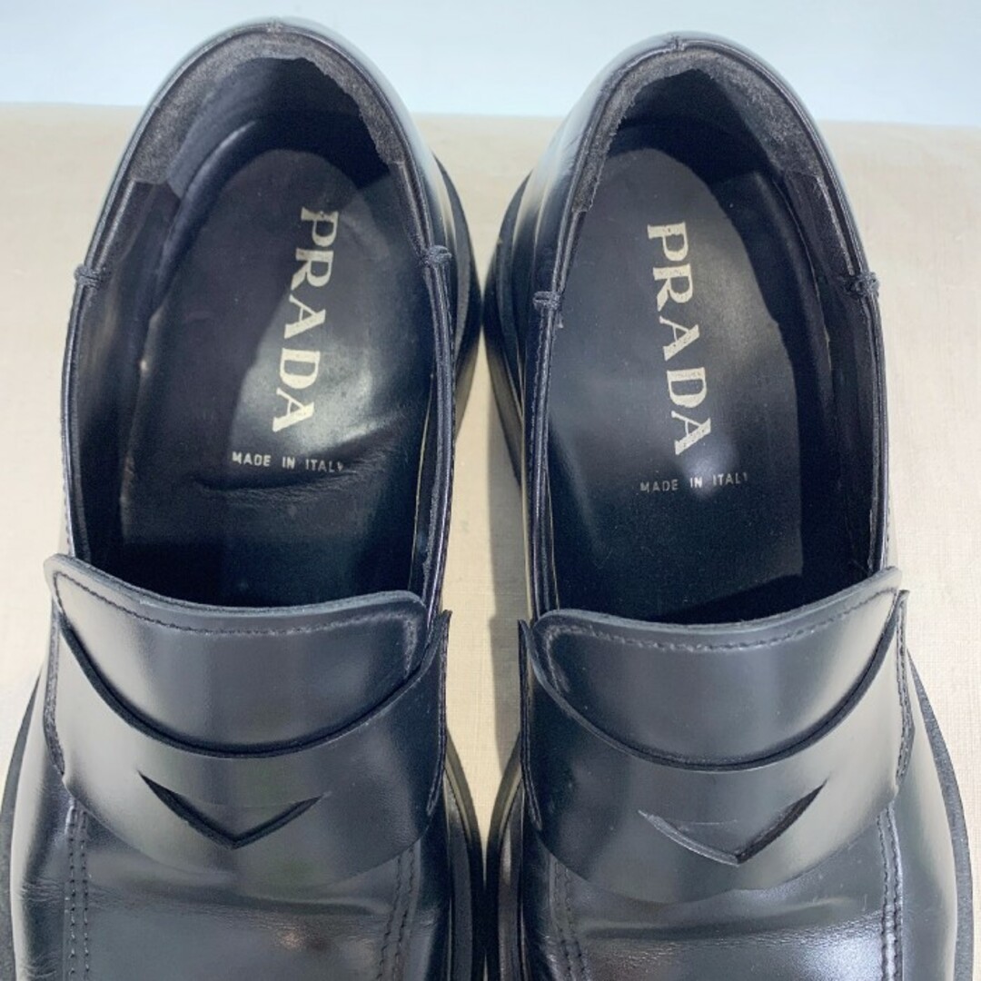 PRADA(プラダ)のPRADA プラダ レザーコインローファー 厚底ソール ブラック 1047 Size 7 (26cm相当) メンズの靴/シューズ(ブーツ)の商品写真