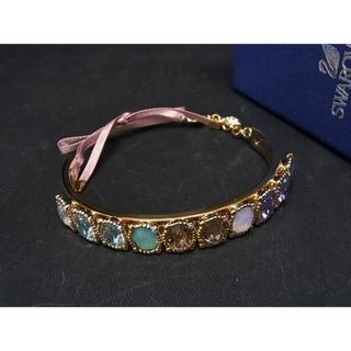 スワロフスキー(SWAROVSKI)の■新品■未使用■ SWAROVSKI スワロフスキー カラーストーン ブレスレット バングル アクセサリー レディース ゴールド系 AT5926 (その他)