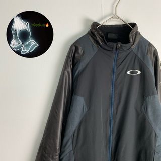 オークリー(Oakley)の【オークリー　トラックジャケット　ダークカラー　ラグラン袖　黒　ネイビー　古着】(その他)