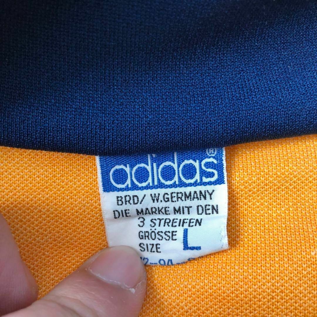 adidas(アディダス)のデサント製Adidasアディダス　トラックジャケット　黄色×紺色古着L メンズのトップス(ジャージ)の商品写真