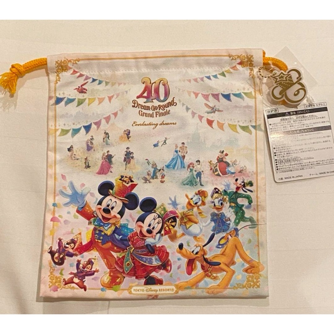 Disney(ディズニー)の【新品】ディズニー 40周年 グランドフィナーレ 巾着 エンタメ/ホビーのおもちゃ/ぬいぐるみ(キャラクターグッズ)の商品写真
