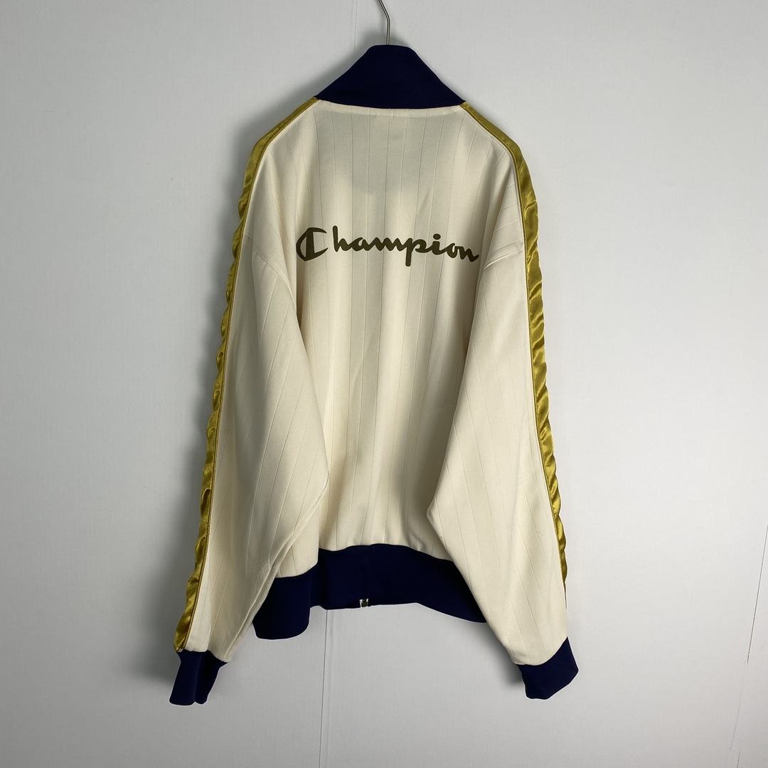 Champion(チャンピオン)の【チャンピオン　トラックジャケット　バックプリント　アイボリー　ネイビー　古着】 メンズのジャケット/アウター(その他)の商品写真