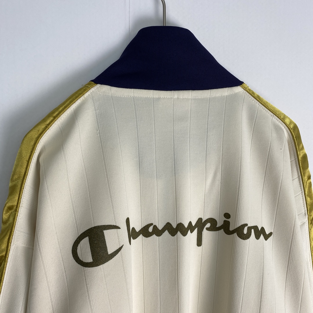 Champion(チャンピオン)の【チャンピオン　トラックジャケット　バックプリント　アイボリー　ネイビー　古着】 メンズのジャケット/アウター(その他)の商品写真