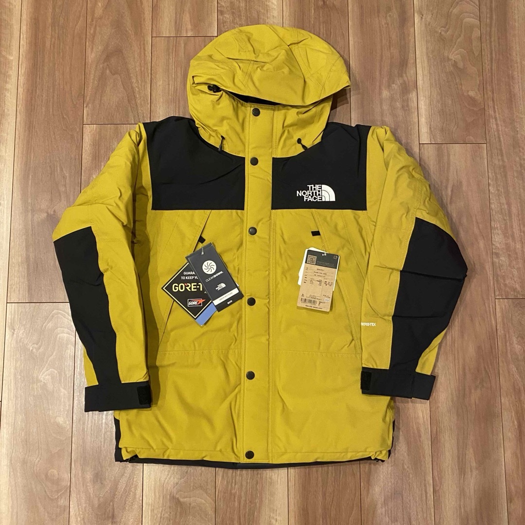 THE NORTH FACE(ザノースフェイス)の新品未使用 ザ・ノース・フェイス マウンテンダウンジャケット Mサイズ イエロー メンズのジャケット/アウター(ダウンジャケット)の商品写真