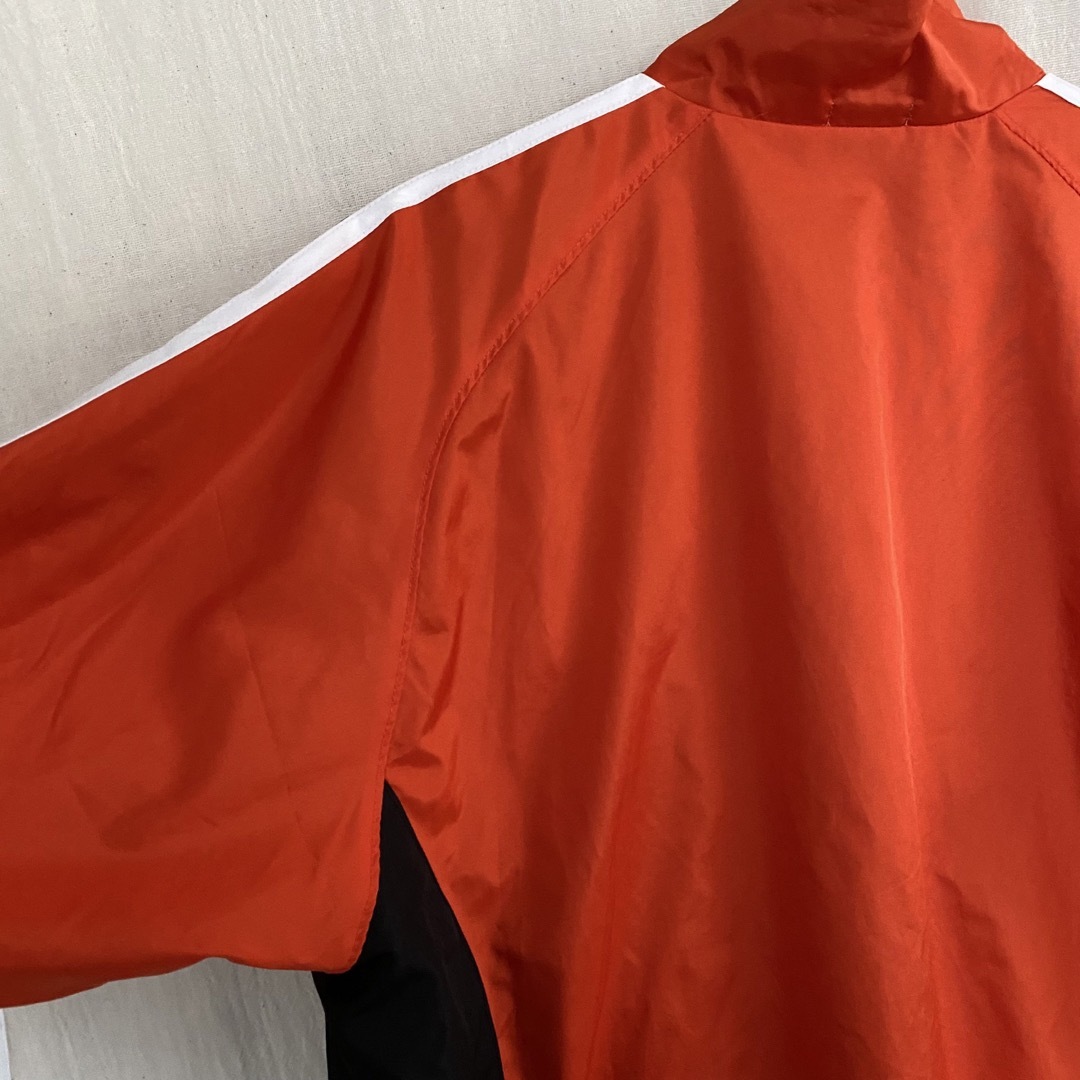 adidas(アディダス)のアディダス　トラックジャケット　ナイロン　アウター　ブルゾン　オレンジ　刺繍ロゴ メンズのジャケット/アウター(ナイロンジャケット)の商品写真