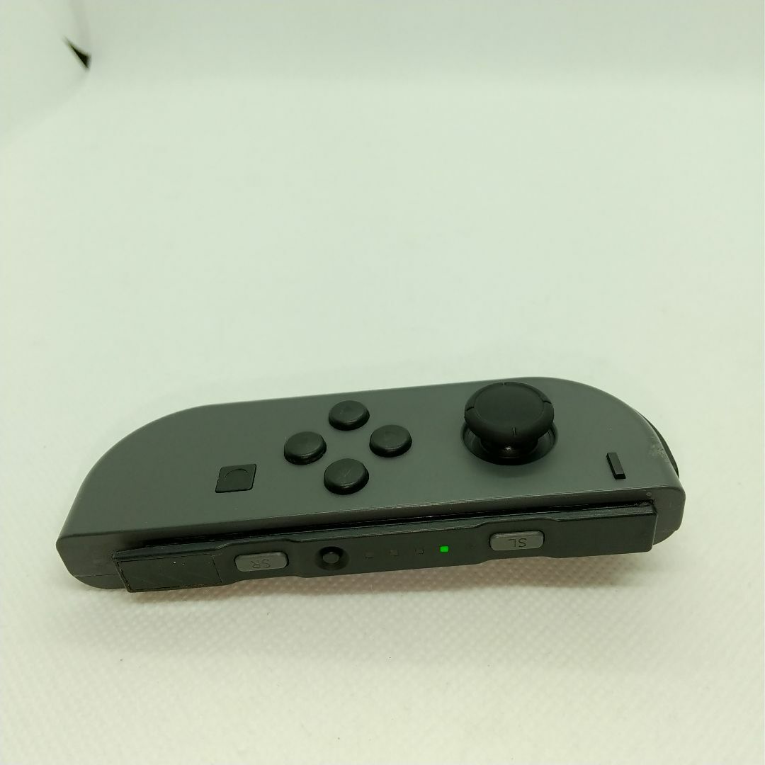 Nintendo Switch(ニンテンドースイッチ)の【廃盤】⑧Switch ジョイコン　グレー　左のみ(L)【任天堂純正品】灰色黒色 エンタメ/ホビーのゲームソフト/ゲーム機本体(家庭用ゲーム機本体)の商品写真