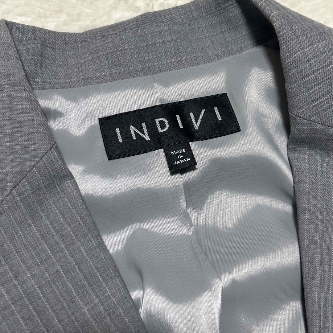INDIVI(インディヴィ)の【美品】INDIVI ストライプ　テーラードジャケット　グレー　05 XS レディースのジャケット/アウター(テーラードジャケット)の商品写真