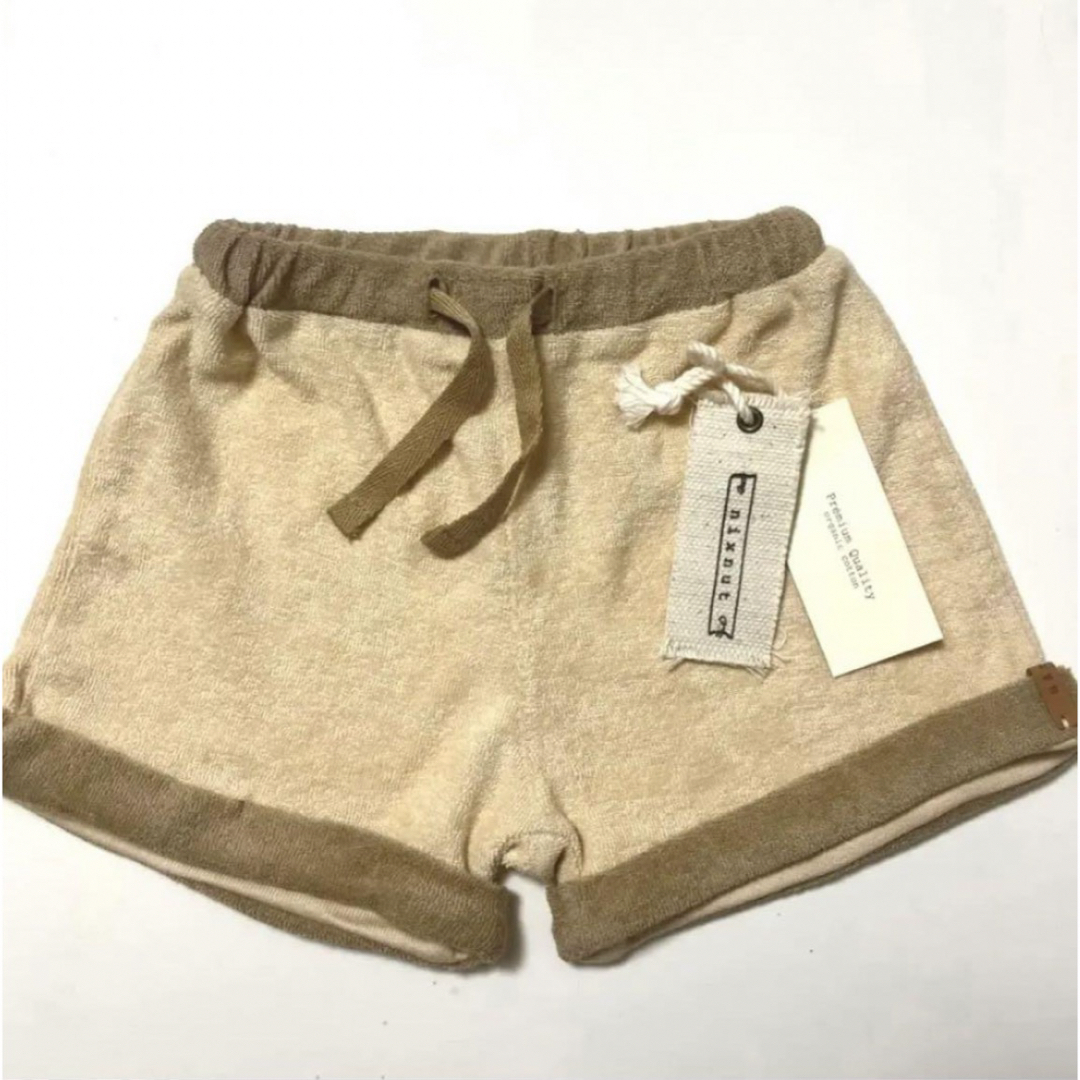 こども ビームス(コドモビームス)の【新品タグ付き】nixnut Uno Short -Latte パンツ　23ss キッズ/ベビー/マタニティのキッズ服男の子用(90cm~)(パンツ/スパッツ)の商品写真