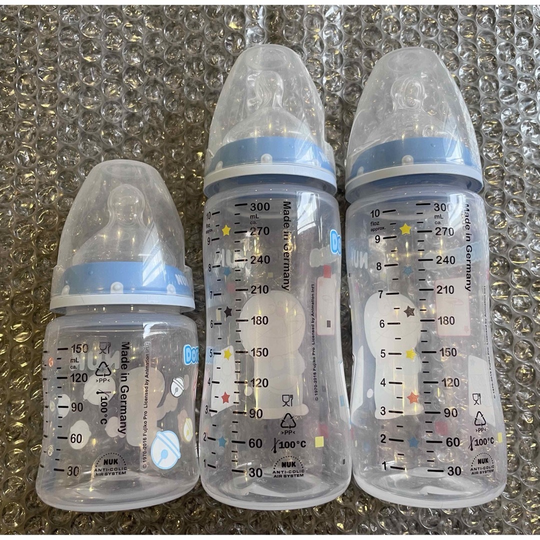 ドラえもん NUK プラスチック哺乳瓶 三本セット パッケージ無し キッズ/ベビー/マタニティの授乳/お食事用品(哺乳ビン)の商品写真