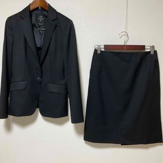 【美品】イネド スカートスーツ 9 日本製 毛 黒 就活 OL ビジネス 春秋冬