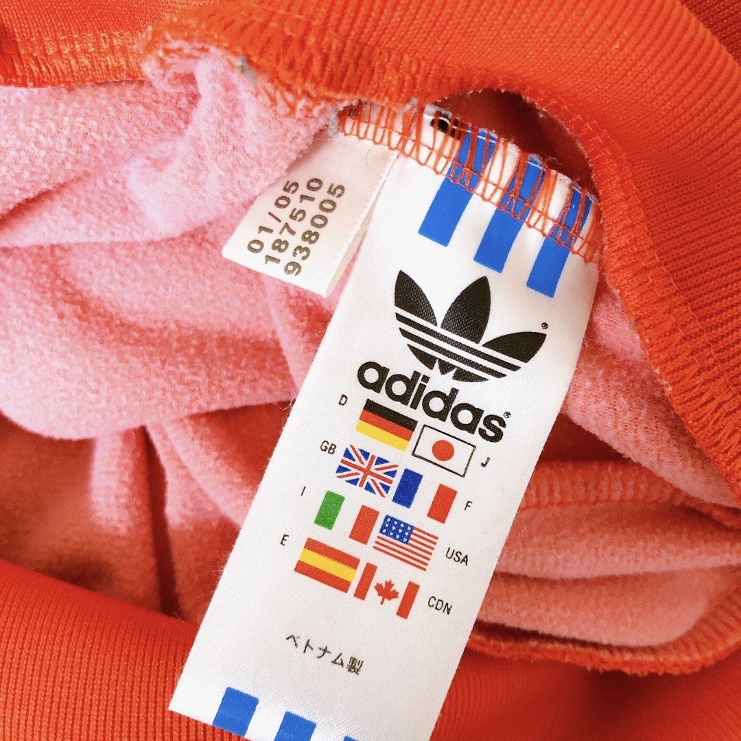 adidas(アディダス)の人気カラー　adidas ATP トラックジャケット 光沢 オレンジ　万国旗 レディースのトップス(その他)の商品写真