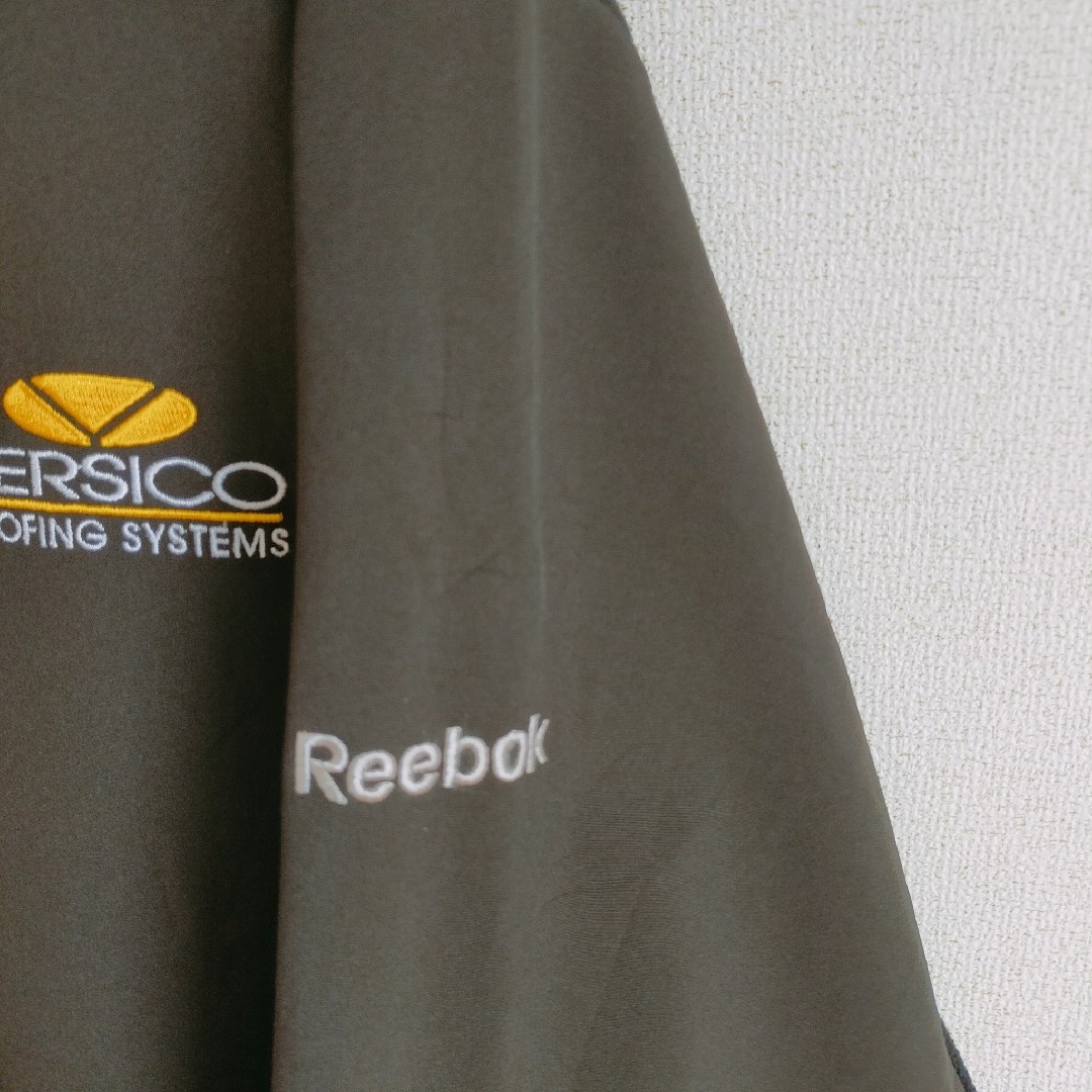 Reebok(リーボック)のReebok トラックジャケット　ジャージ　企業ロゴ刺繍　ブラック　XL メンズのトップス(ジャージ)の商品写真
