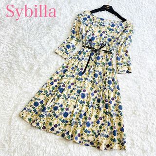 シビラ(Sybilla)のシビラ ひざ丈ワンピース M 花柄 総柄 Aライン フレア ウール ベージュ(ひざ丈ワンピース)