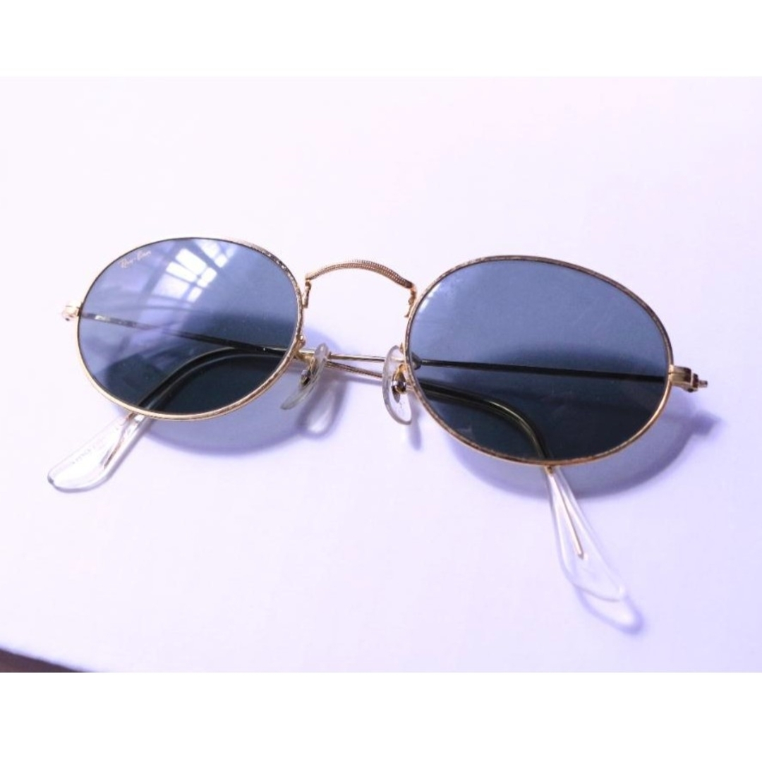 Gold Ray ban aviator sunglasses on a black background Stock Photo - Alamy