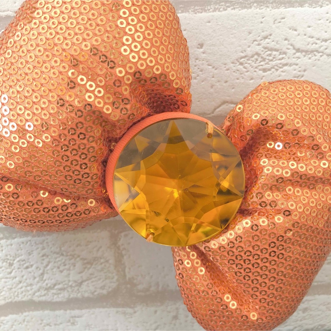 ハローキティ(ハローキティ)のハローキティ  カチューシャ　スパンンコール　リボン　オレンジ　USJ ユニバ レディースのヘアアクセサリー(カチューシャ)の商品写真