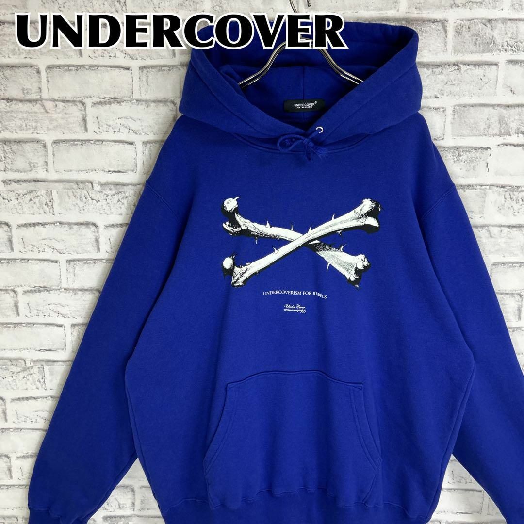 UNDERCOVER(アンダーカバー)のUNDERCOVER アンダーカバー パーカー クロスボーン サイズ3 プリント メンズのトップス(パーカー)の商品写真