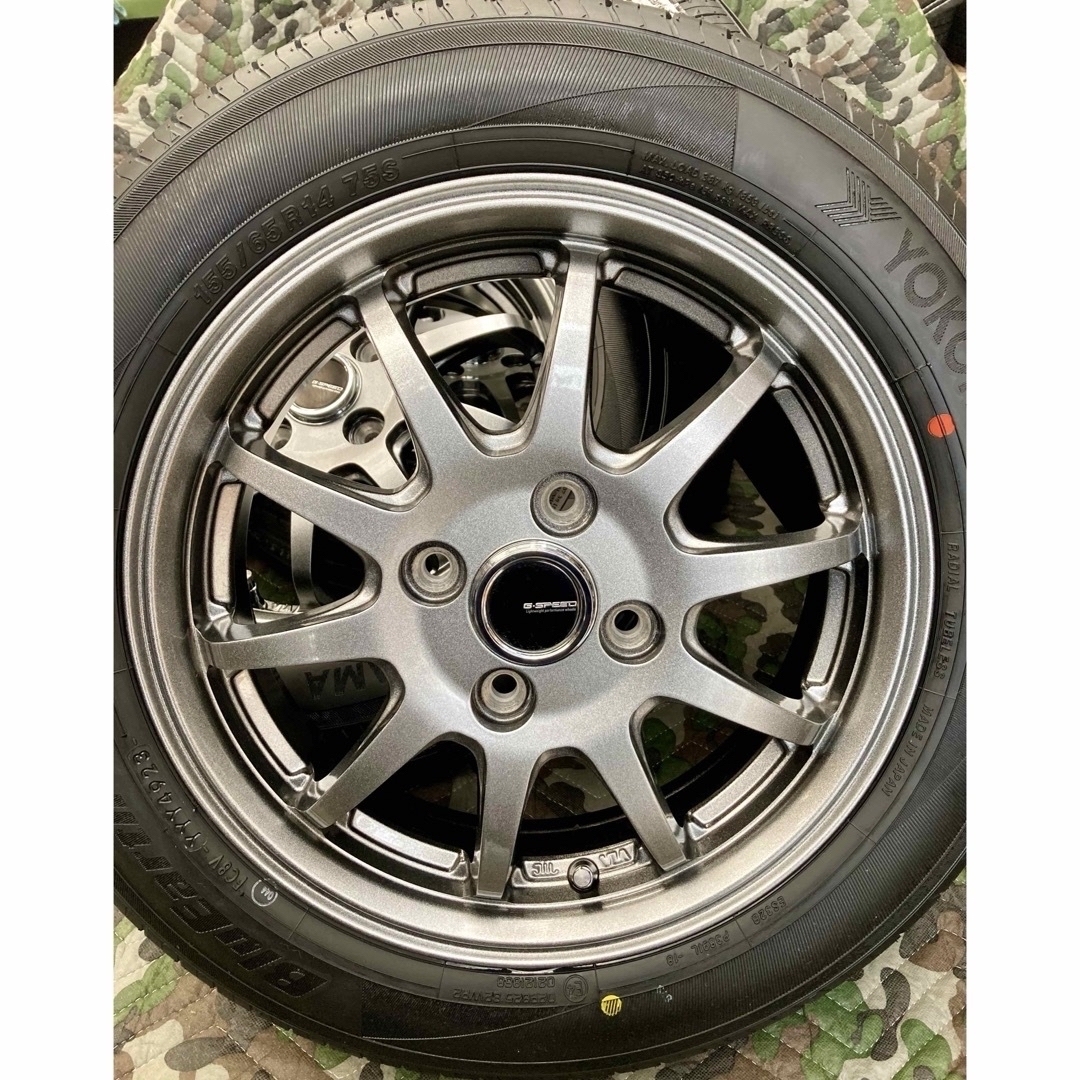 ヨコハマ(ヨコハマ)の⑱155/65R14新品ヨコハマタイヤ4本と中古美品ホイールとナット付き 自動車/バイクの自動車(タイヤ・ホイールセット)の商品写真